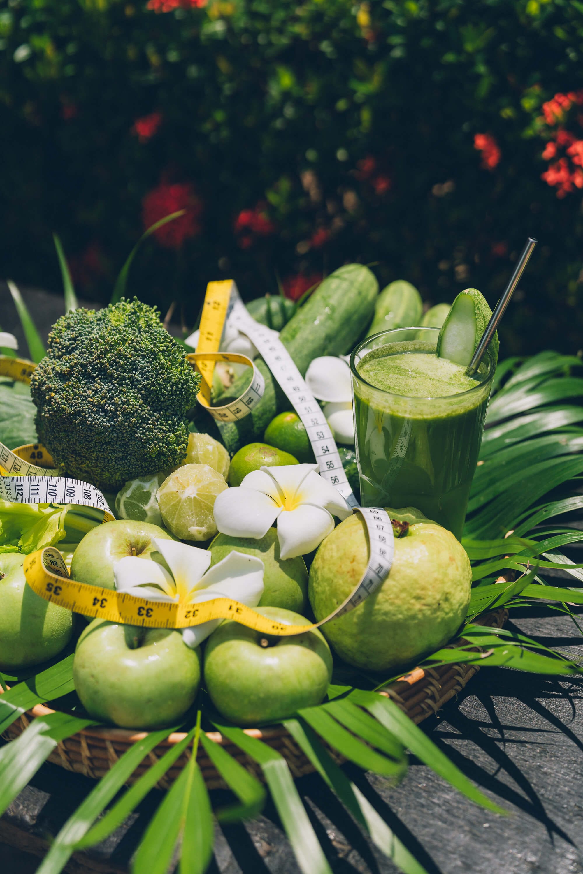 Green produce, juice and tape measure